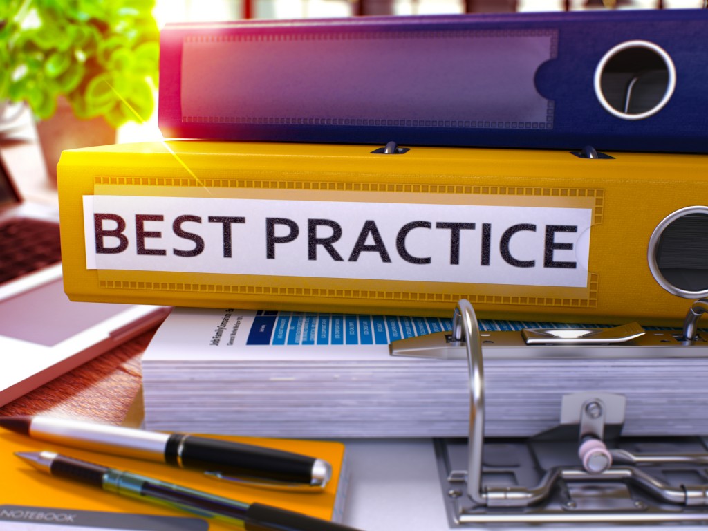 Best Practice - Yellow Ring Binder on Office Desktop with Office Supplies and Modern Laptop. Best Practice Business Concept on Blurred Background. Best Practice - Toned Illustration. 3D Render.